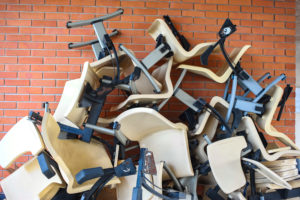 Pile of old office chairs ready for clean out by Black Diamond
