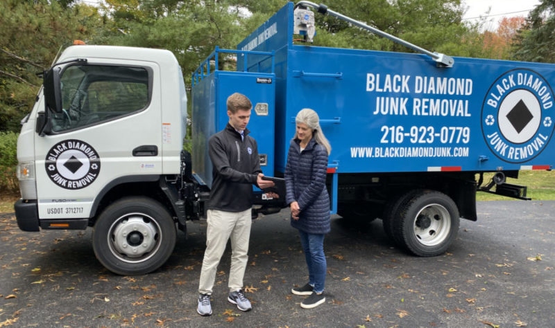 black diamond junk removal expert quoting customers after junk removal services
